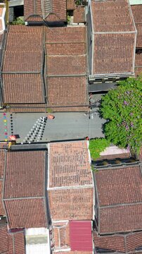 Aerial drone view of Hoi An city, Quang Nam province, Vietnam. Panoramic footage of Ancient town, UNESCO world heritage. One of the most travel popular touristic destinations
