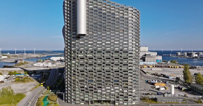 Aerial view of Copenhill waste to energy plant featuring innovative urban architecture with rooftop ski slope in Copenhagen Denmark.
