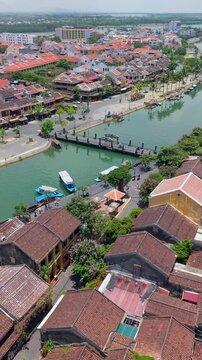 Aerial drone view of Hoi An city, Quang Nam province, Vietnam. Panoramic footage of Ancient town, UNESCO world heritage. One of the most travel popular touristic destinations 