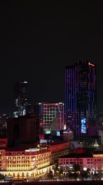Vertical screen, Vietnam, Ho Chi Minh Colonial Hotel Facade Meets Neon Skyscraper Lines In Ho Chi Minh, Warm Heritage Architecture Contrasted With Vertical LED Patterns, Drone Sweep