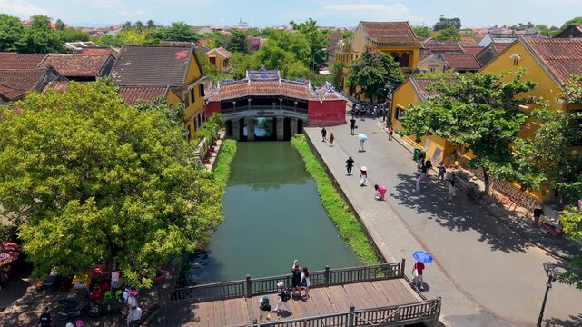 Aerial view of Chua Cau or Japanese Covered ancient Bridge and River in Old city of Hoi An, Vietnam. One of the most travel popular touristic destinations, UNESCO world heritage 