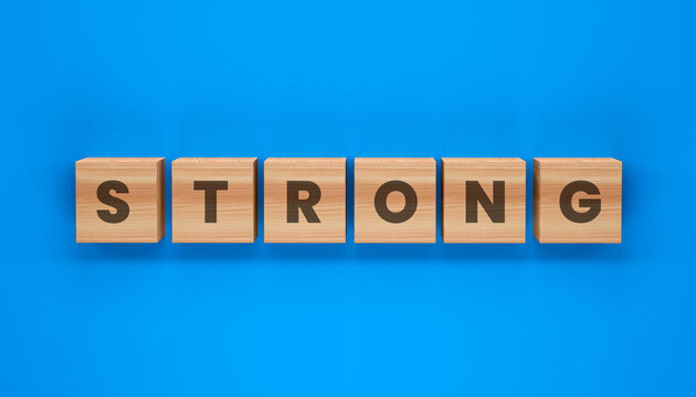 The Word STRONG: Six wooden blocks with the letters spelling STRONG are neatly arranged on a vibrant blue background, symbolizing resilience and power.