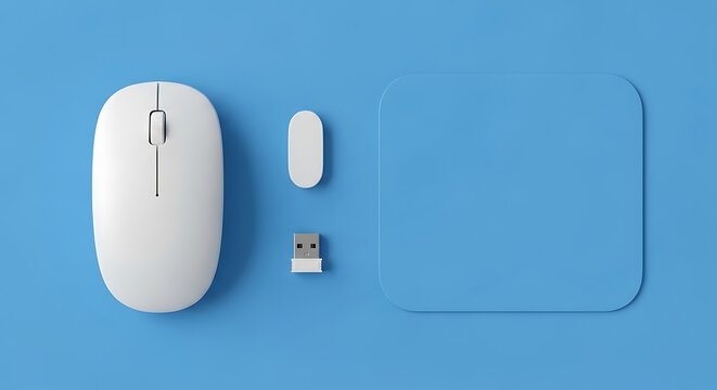 Top view of a modern white wireless computer mouse and USB receiver set arranged on a vibrant blue background for office tech setup