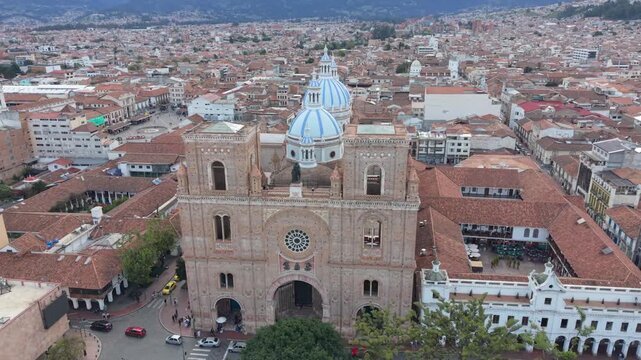 Aerial Drone View of Parque Calder&oacute;n and New Cathedral in Cuenca Ecuador &ndash; Historic City Center. Aerial view featuring colonial architecture, blue domes of the cathedral, surrounding plazas.