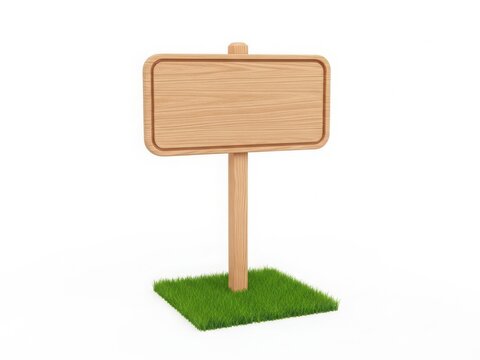 A blank wooden signpost standing on a small patch of artificial grass.
