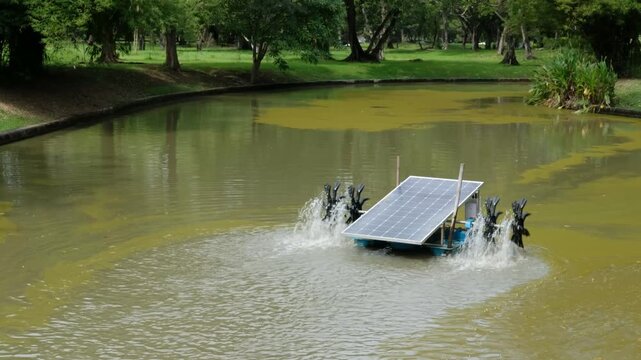 Solar energy powered aerator improving water quality in urban park pond, green technology idea