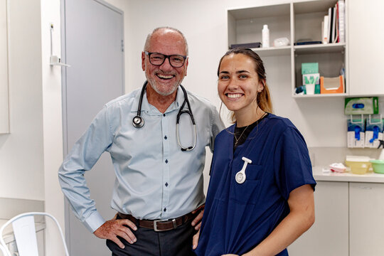 Doctor and nurse standing in clinic with medical supplies