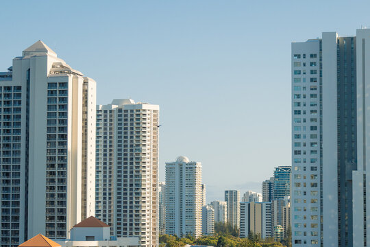 Modern high-rise apartment buildings under a clear blue sky on the Gold Coast