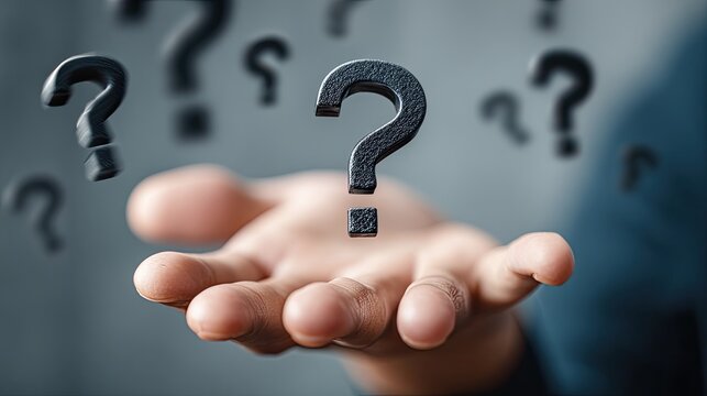 Open hand holds a large question mark, others float
