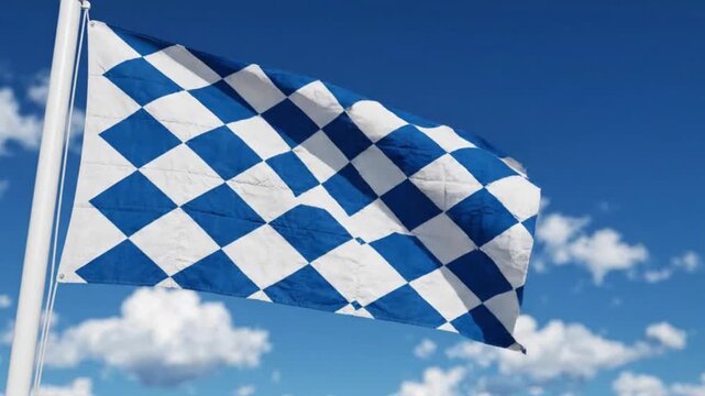 Bavarian flag waving against a blue sky with clouds