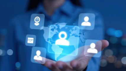 Naklejka premium Global Network of People: A hand holds a glowing holographic earth, surrounded by icons of people and a message icon, symbolizing interconnectedness and global communication.
