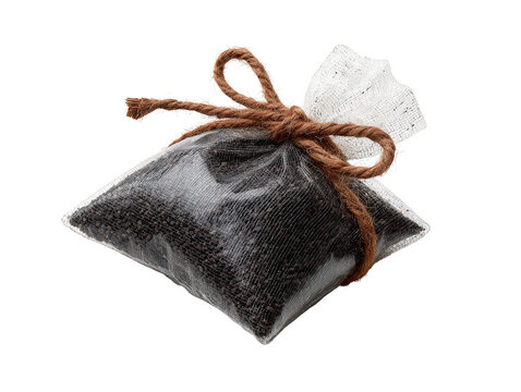A small black tea bag with brown string tied in a bow isolated on transparent background