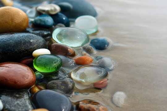 Sea glass and polished stones in shallow tide