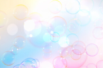 Obraz premium Beautiful Clear Colorful Soap Bubbles Fantasy. Celebration Festive Backdrop. Freshness Soap Suds Bubbles Water. Blue, Pink and White Gradient Textured. Colors Fantasy Blurred Background.