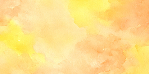 Obraz premium Warm yellow and orange watercolor background with soft blended colors and texture