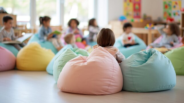 Diverse young children sitting on colorful beanbag chairs during a classroom activity, learning and playing