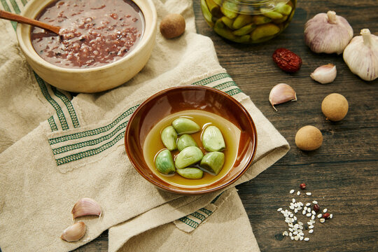 Traditional Laba Garlic and Rice Porridge on Rustic Table