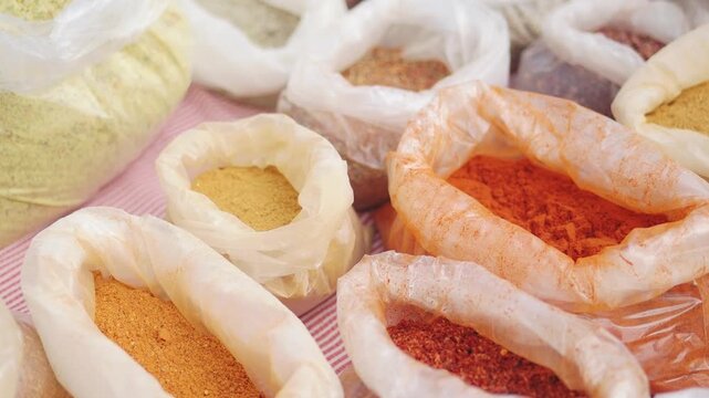 Spices displayed at market in early morning light