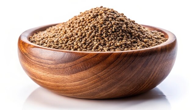 Brown organic ajwain seed in a wood bowl on a white background ajowan seed