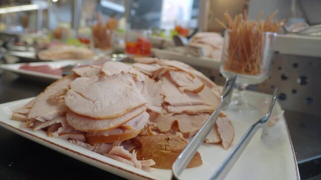 Slices of meat prepared for a lunch buffet at a restaurant
