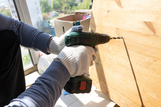 Percussion drilling work with green power tool in residential repair