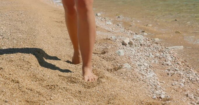 Young Woman Walking on the Pebble Beach of Vela Luka on Krk Island, Croatia