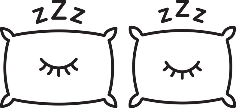 Two pillows with sleeping eyes and zzz symbols.