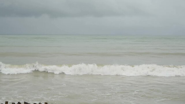 crazy seascape view of ocean sea under heavy storm strong wind weather with heavy huge wave to the sand beach. south sea of thailand in stormy weather