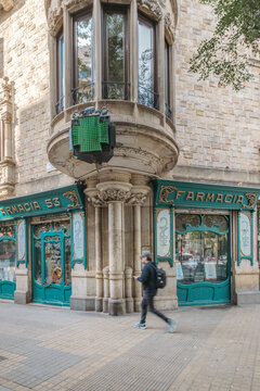 Historic Pharmacy Facade, Catalan Modernisme Green Woodwork, Decorative Ornaments, Pedestrian Walking, Barcelona