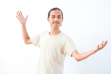 Naklejka premium Young Asian man in a shirt, confidence gesture and positive expression. Isolated in white background