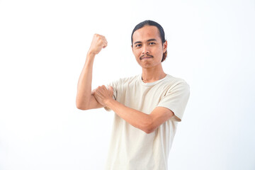 Naklejka premium Young Asian man in a shirt, confidence gesture and positive expression. Isolated in white background