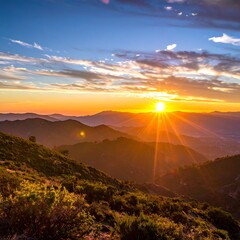 Obraz premium Vibrant sunset over a serene mountain range with lush greenery