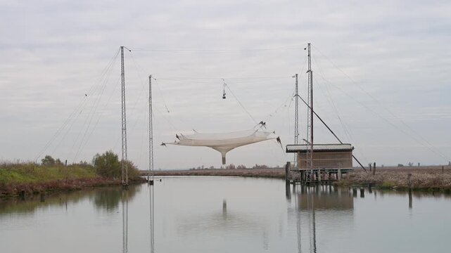 Traditional Fishermen Net Supported by Casoni in Venice Lagoon Italy