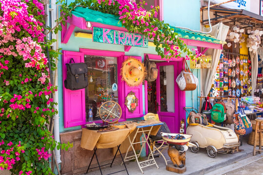 Ayvalik - Turkey, May 17, 2026, Charming Boutique Shop  on Cunda Island with Pink Windows and Bougainvillea