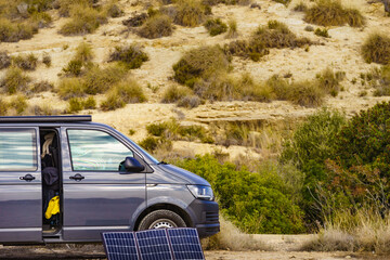 Portable solar photovoltaic panel, charging battery at camper van vehicle.