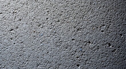 Obraz premium Close up of a textured concrete surface with subtle shadows.