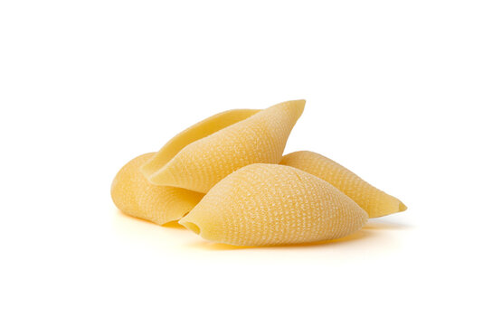 Raw conchiglioni pasta isolated. Dry conchiglie noodle in shell shape, big Italian macaroni