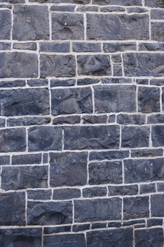 rough cut old bluestone wall