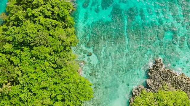 Beautiful landscape of waves on rocks. Carabao Island. San Jose, Romblon. Philippines.