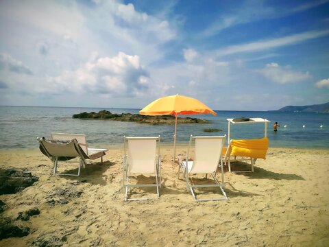 Acciaroli Beach Deckchairs Orange Umbrella Clear Turquoise Sea Italy