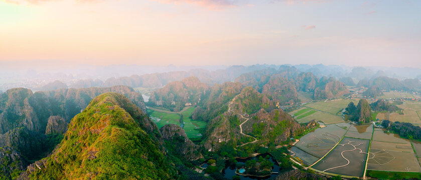 Scenic aerial view of mountainous landscape and rice paddies in Ninh Binh, Vietnam