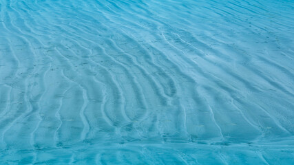 Summer background lagoon Ripples in the sand at low tide on a beach with sandbar and blue sea in Maldives island © SASITHORN