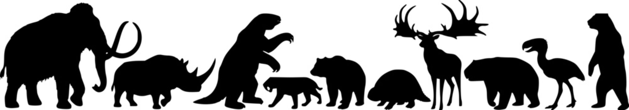 Set of silhouettes of prehistoric extinct animals including a woolly mammoth, saber-toothed cat and giant deer isolated on white background