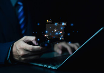Fototapeta premium Businessman using smartphone with social media icons, likes, comments, and shares, representing digital marketing, online communication, engagement, social networking, and mobile technology.