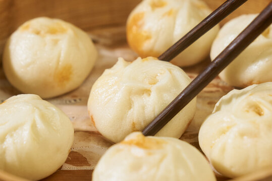 Golden Steamed Buns with Chopsticks