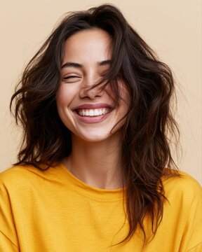 Cute smiling girl portrait with playful hair falling over her face