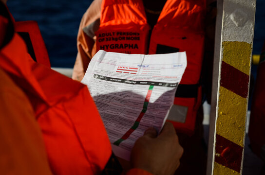 The emergency drill on board of the offshore support vessel. Chief officer is challenging the crew knowledge of their emergency duties as per the muster checklist. Douala, 