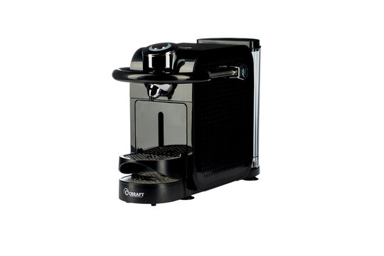 Modern black capsule coffee machine isolated on a white background