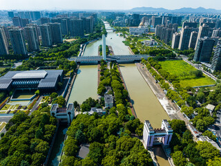 Aerial view of modern city canal with bridges and high-rise buildings © LuuDieuThanh