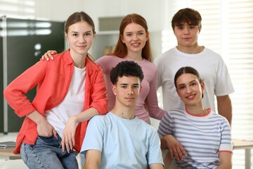 Obraz premium Portrait of happy students together in classroom